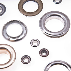 Steel eyelets for effective finishing of holes in materials